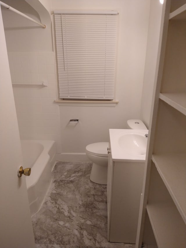 full bathroom featuring vanity, tub / shower combination, and toilet