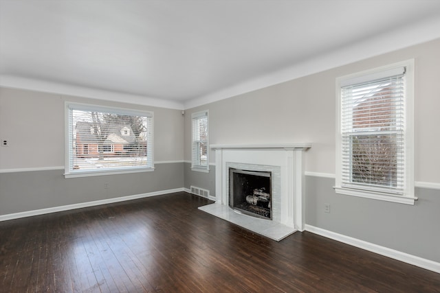 unfurnished living room featuring dark wood-type flooring