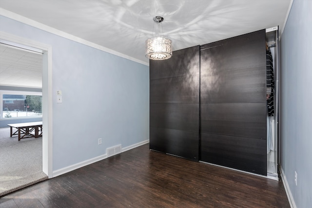 spare room with dark hardwood / wood-style flooring