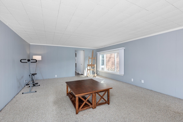 carpeted living room with ornamental molding