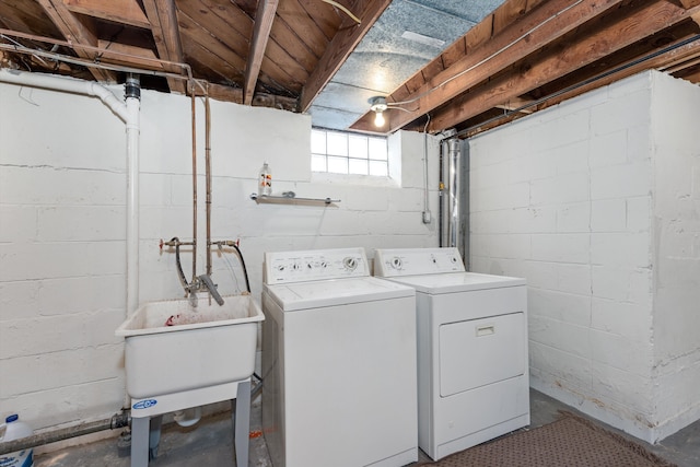 washroom featuring washer and dryer and sink