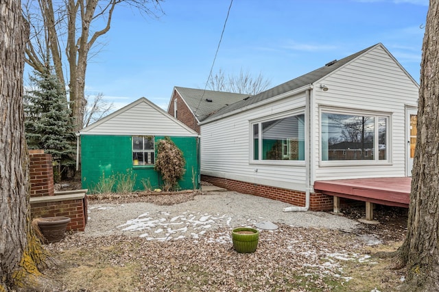 view of property exterior with a deck