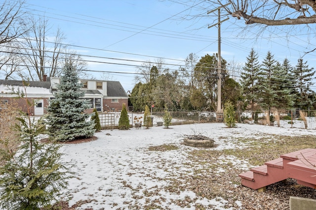 view of yard layered in snow