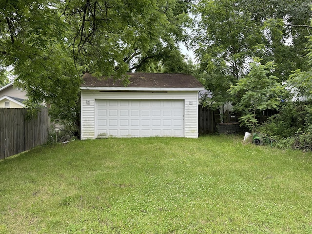 garage featuring a yard