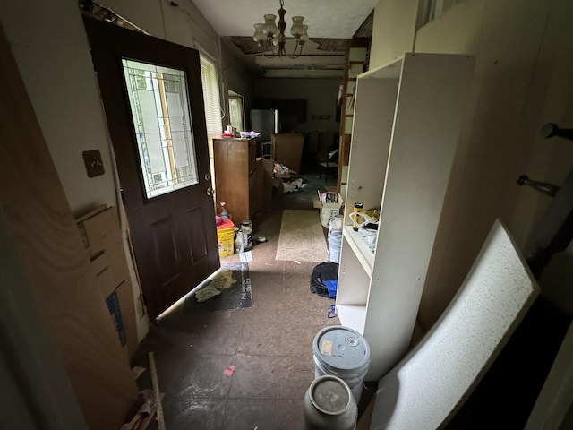 miscellaneous room with a notable chandelier