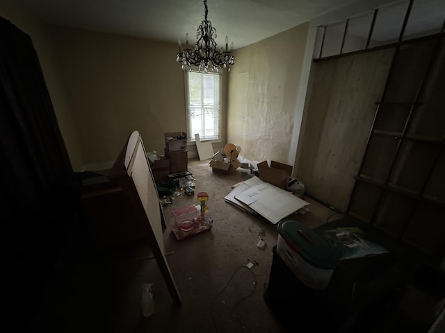 miscellaneous room with a chandelier