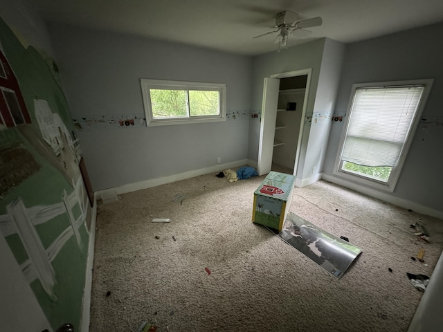 interior space featuring ceiling fan