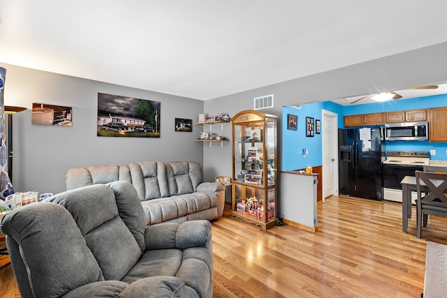 living room with light hardwood / wood-style flooring