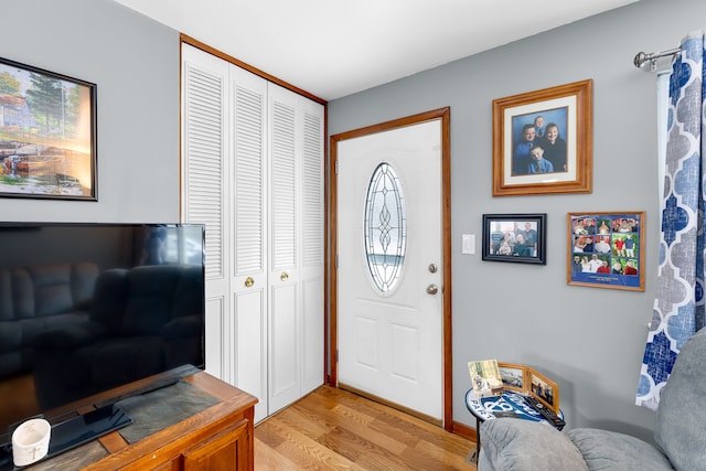 foyer entrance with light hardwood / wood-style floors