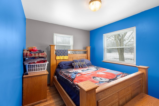 bedroom with hardwood / wood-style flooring