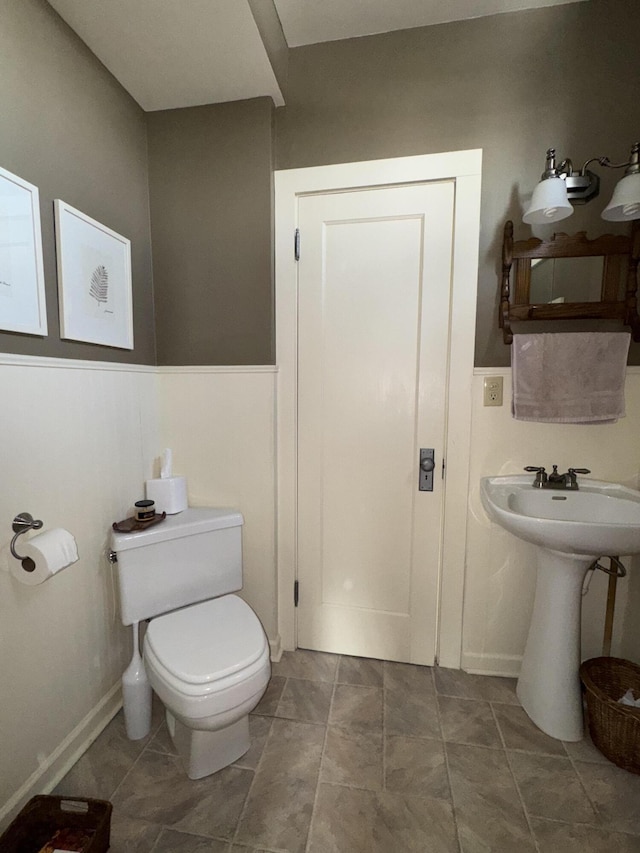 bathroom featuring sink and toilet