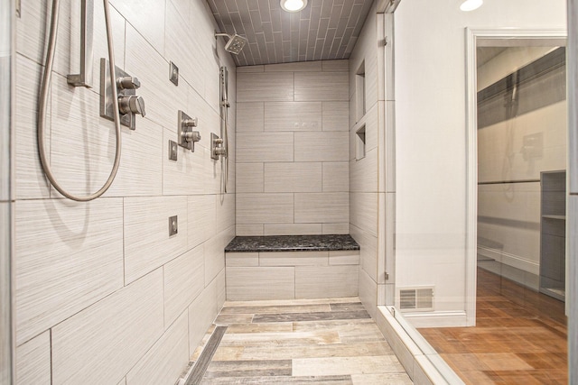 bathroom with a tile shower