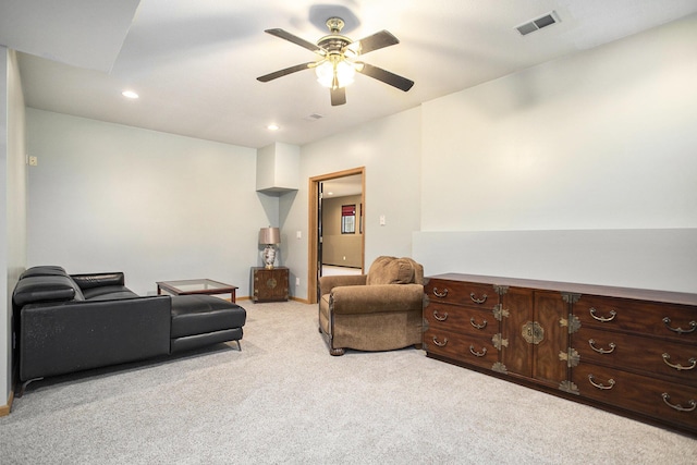 living room with light colored carpet and ceiling fan