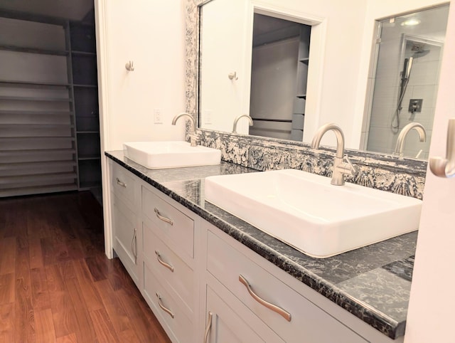 bathroom with vanity and wood-type flooring