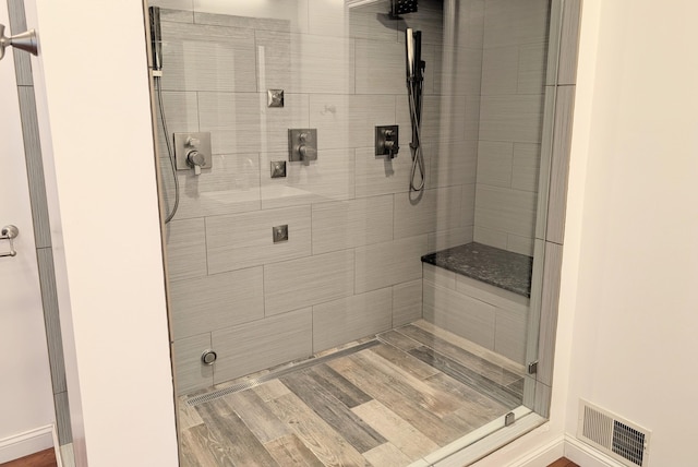 bathroom with a tile shower