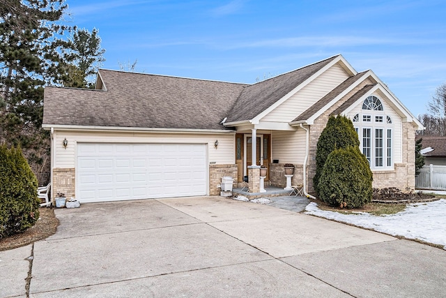 view of front facade featuring a garage and covered porch