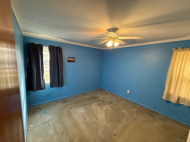 unfurnished room with ornamental molding, ceiling fan, and carpet