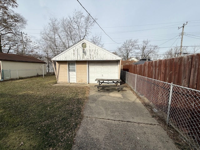 garage featuring a lawn