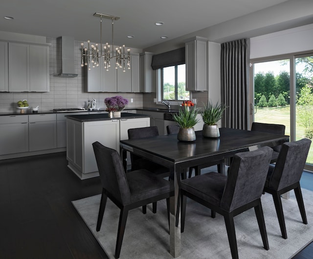 dining room with dark hardwood / wood-style floors and sink