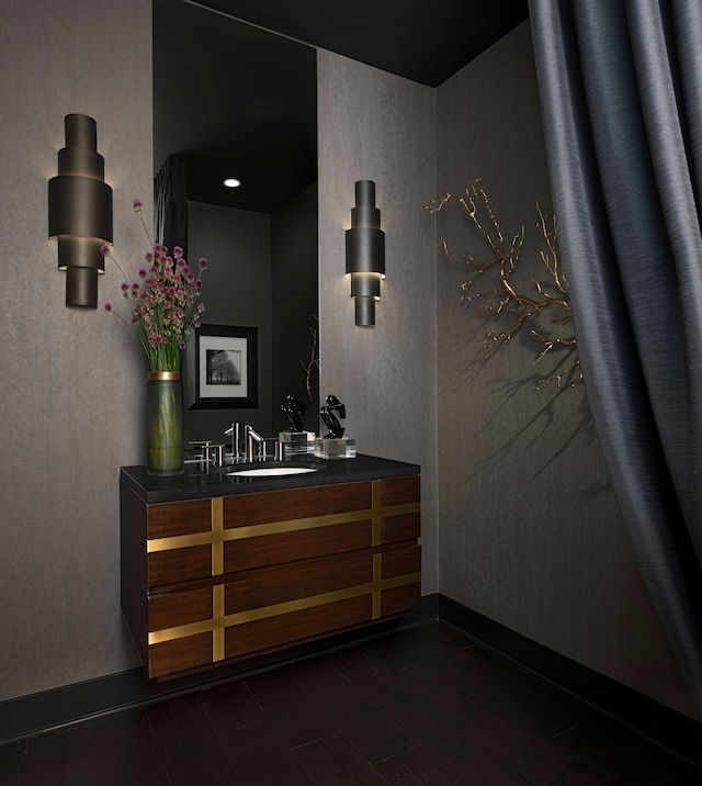 hallway featuring sink and dark hardwood / wood-style floors