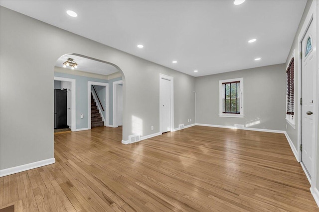 unfurnished living room featuring light wood-type flooring