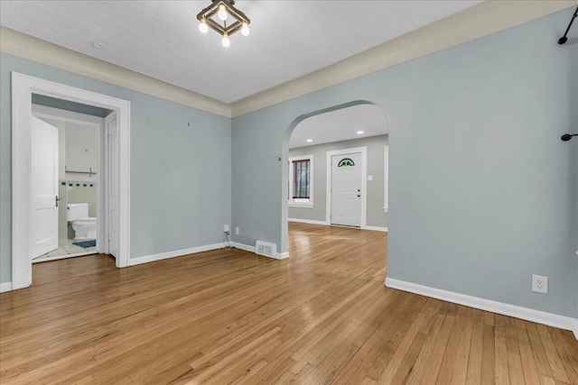 spare room with light hardwood / wood-style flooring