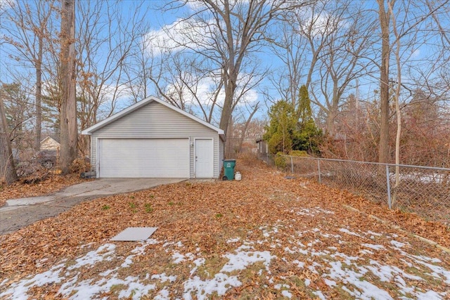 view of side of property with a garage and an outdoor structure