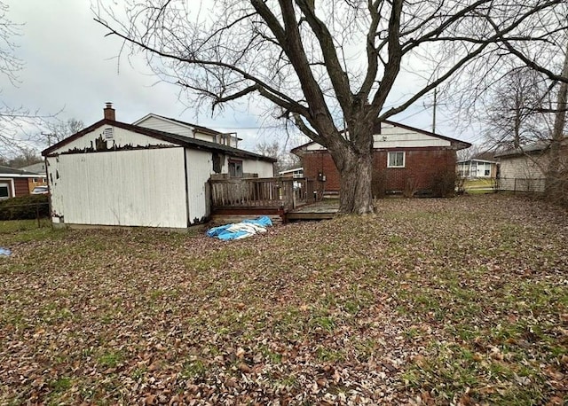 view of yard with a wooden deck