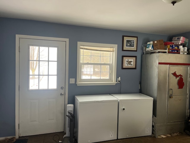 washroom with separate washer and dryer