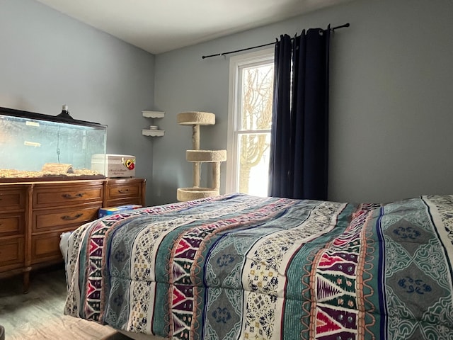 bedroom with wood-type flooring