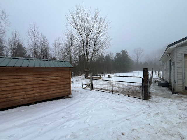 view of yard layered in snow