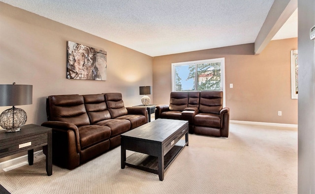 living room featuring light carpet and a textured ceiling