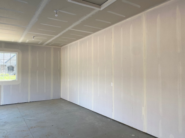 empty room featuring unfinished concrete flooring