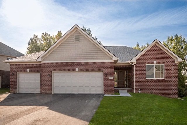 ranch-style house with driveway, brick siding, roof with shingles, an attached garage, and a front yard