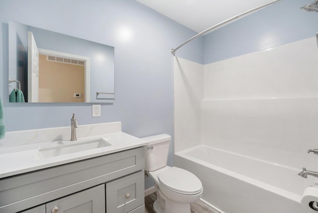 full bathroom featuring shower / tub combination, vanity, and toilet