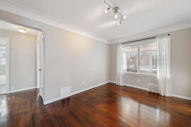 spare room with dark hardwood / wood-style flooring