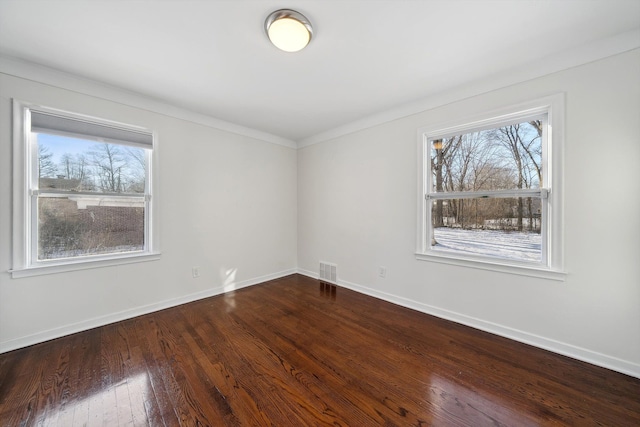 spare room with hardwood / wood-style flooring