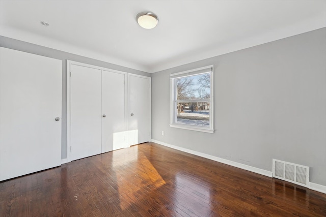 unfurnished bedroom with wood-type flooring