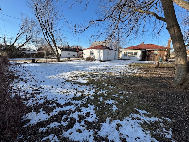 view of yard layered in snow