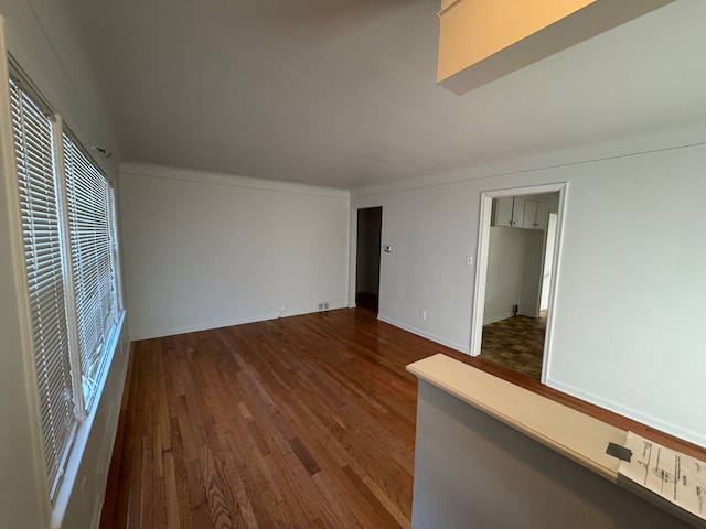 empty room with hardwood / wood-style floors