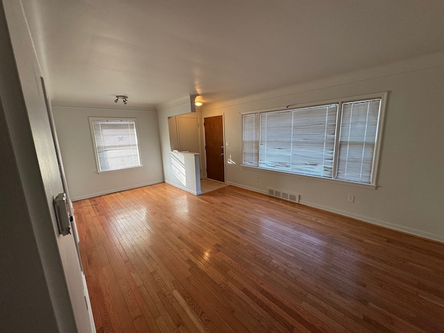 unfurnished living room featuring light wood-type flooring