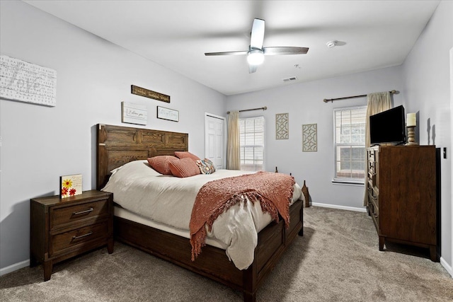 bedroom with light colored carpet and ceiling fan