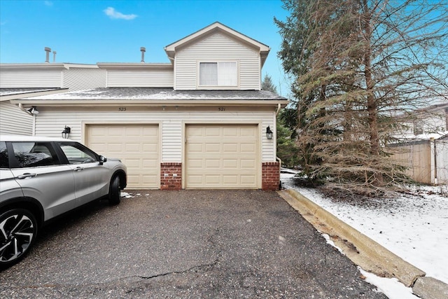 view of snow covered garage