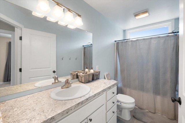 bathroom with vanity, a shower with curtain, and toilet