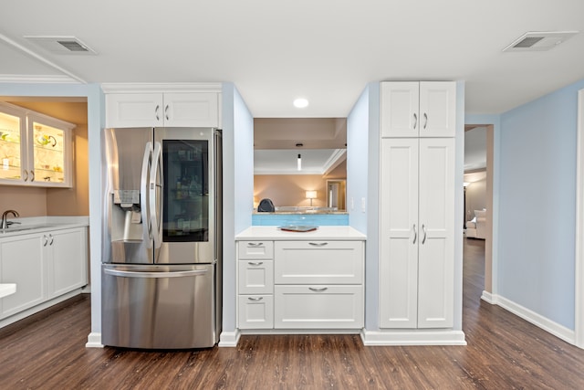 kitchen with white cabinetry, dark hardwood / wood-style flooring, and stainless steel fridge with ice dispenser