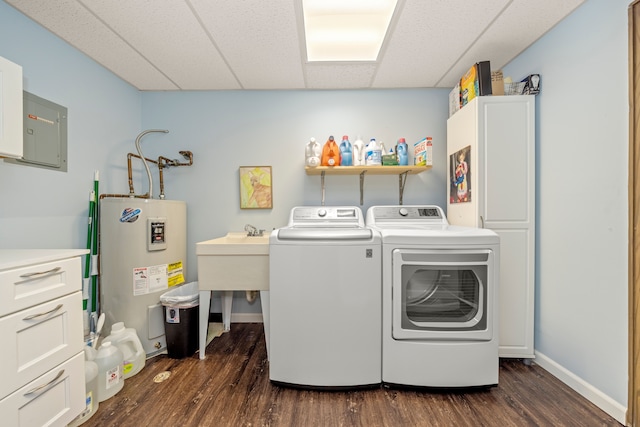 washroom with water heater, separate washer and dryer, cabinets, electric panel, and dark wood-type flooring