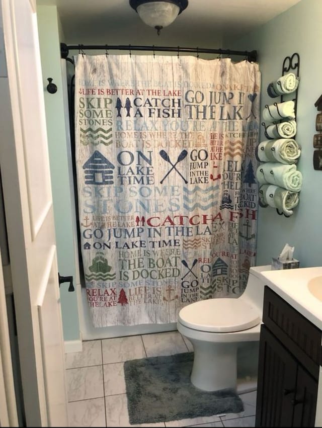 full bathroom with vanity, tile patterned flooring, toilet, and shower / bath combo with shower curtain