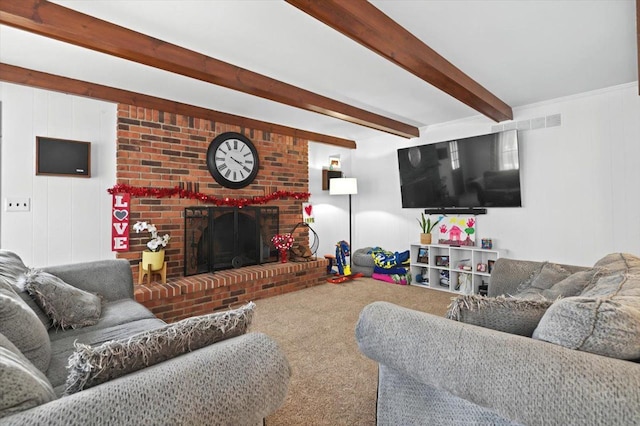 carpeted living room with a brick fireplace and beam ceiling