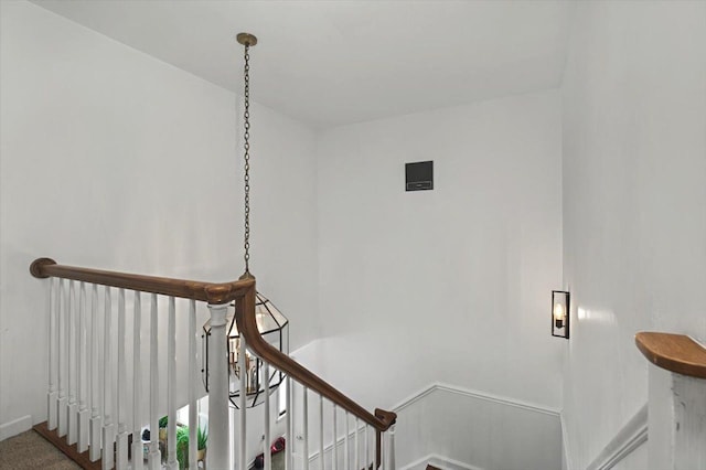 staircase featuring baseboards