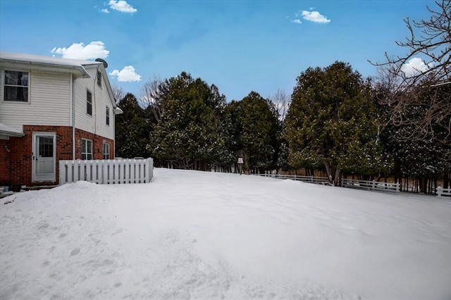 view of yard covered in snow